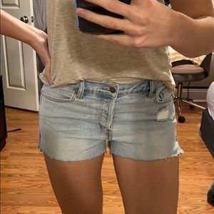 Classic light wash denim shorts with raw hem
